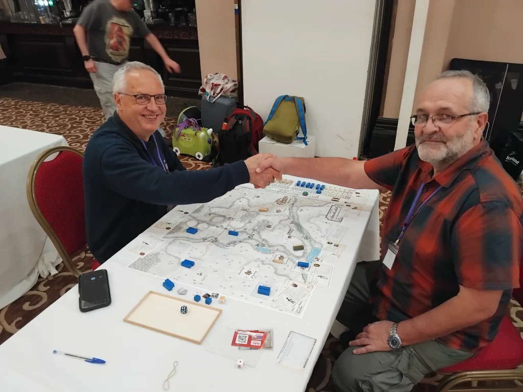Yves Roig and Andy Loakes shaking hands after a game on Austerlitz – Coup de Tonnerre!
